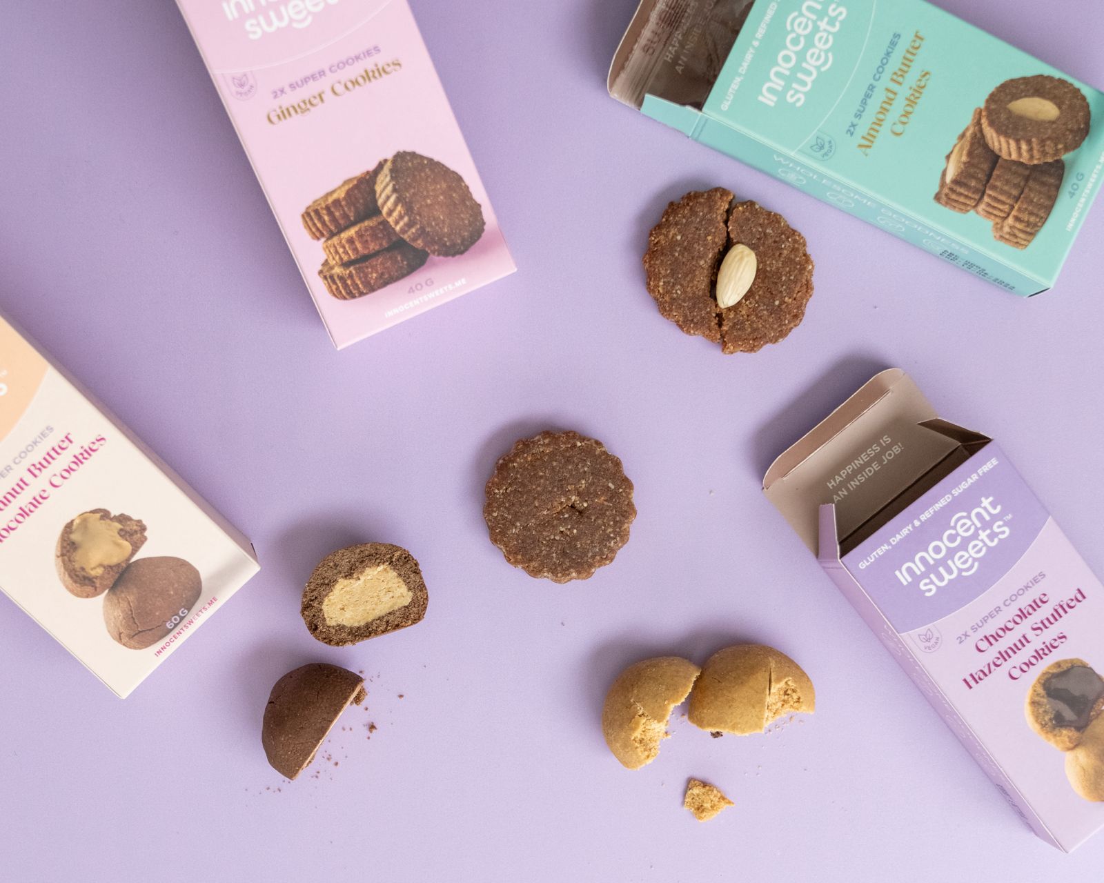 Innocent Sweets - Cookies and their packaging on a purple background